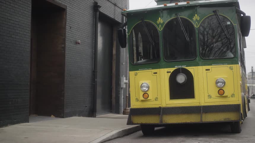 A bus travels on a city street