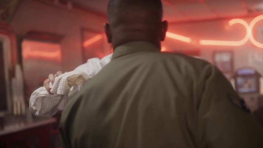 A soldier enters a diner