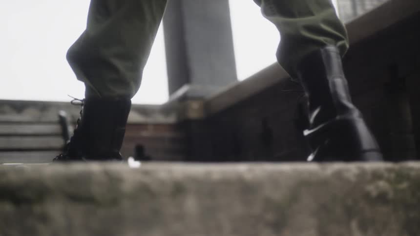 A soldier walks up the steps