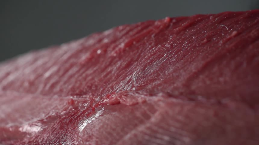 Fish meat is displayed on the counter