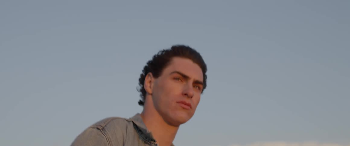 A man stands outside in the wind