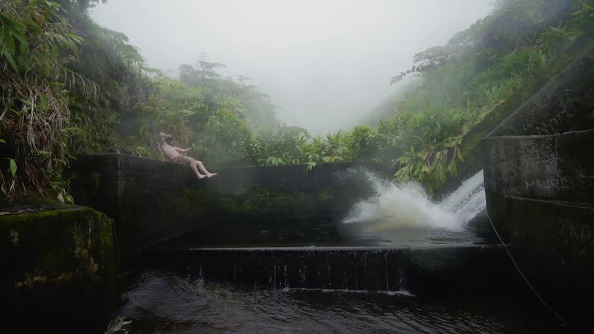 A man slides down into the water