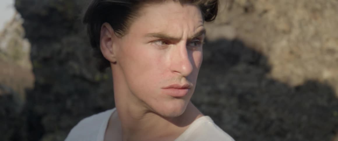 A young man looks around outside