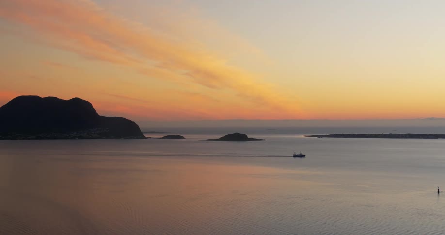 A boat in the distance at dusk