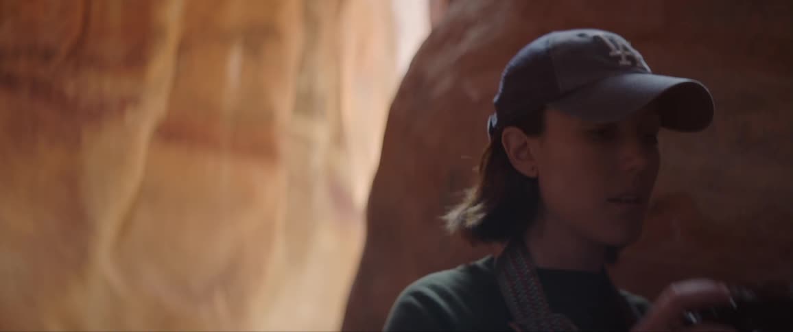 Woman Taking Photographs And Exploring Canyons