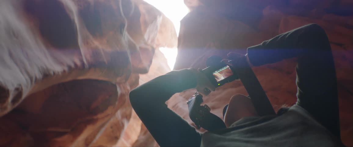 Woman Taking Photographs And Exploring Canyons