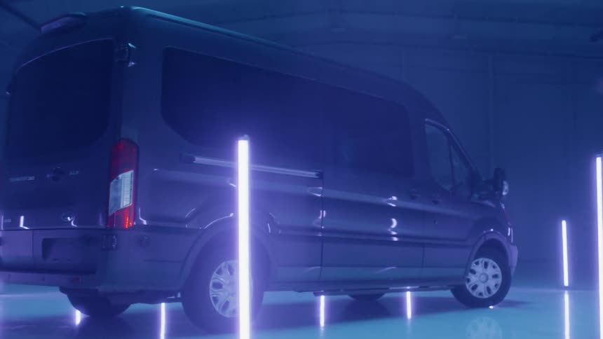 The van is parked between the lights