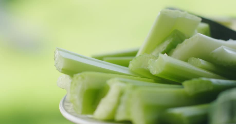 Plate of celery on a table outside