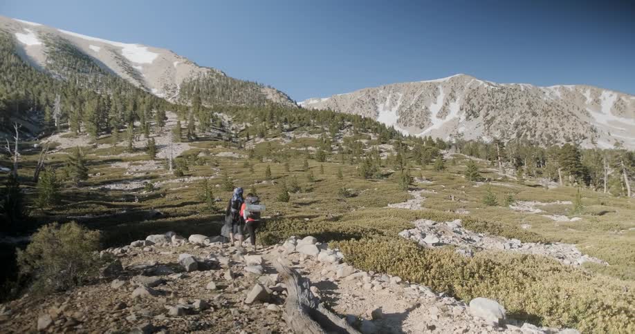 Hikers trek towards the mountain