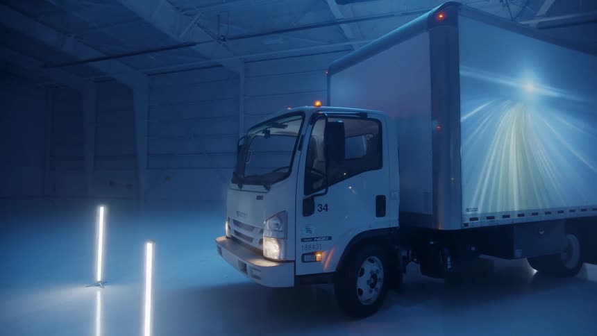 Images are projected onto the side of a box truck