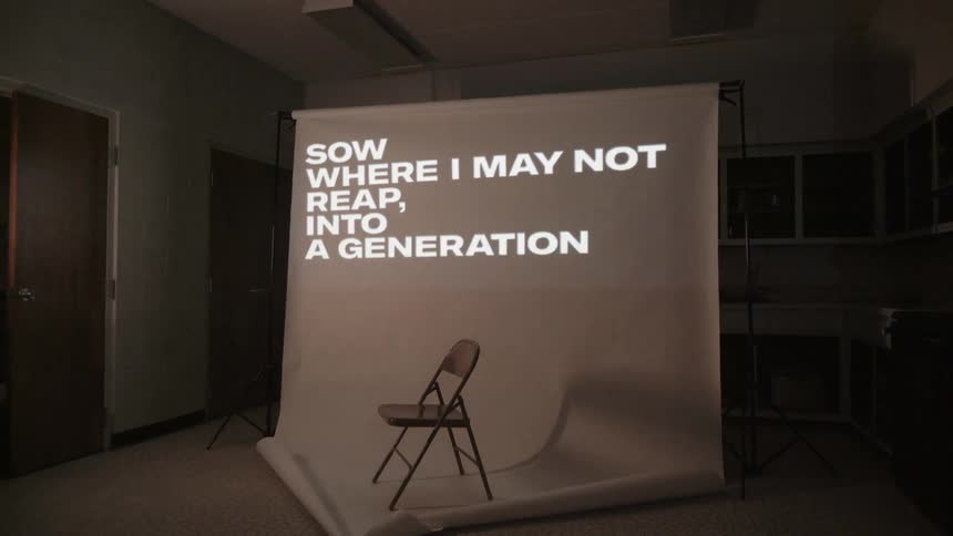 Words are projected onto a screen
