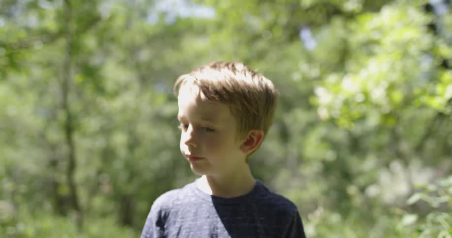Two Boys Playing In Forest