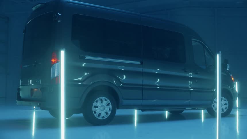 Lights glow around a van in a warehouse