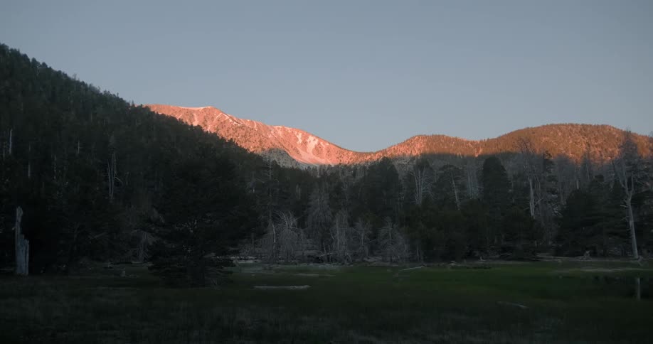 Sunlight shines on a mountain ridge