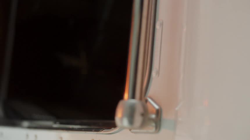 A man pulls open a door