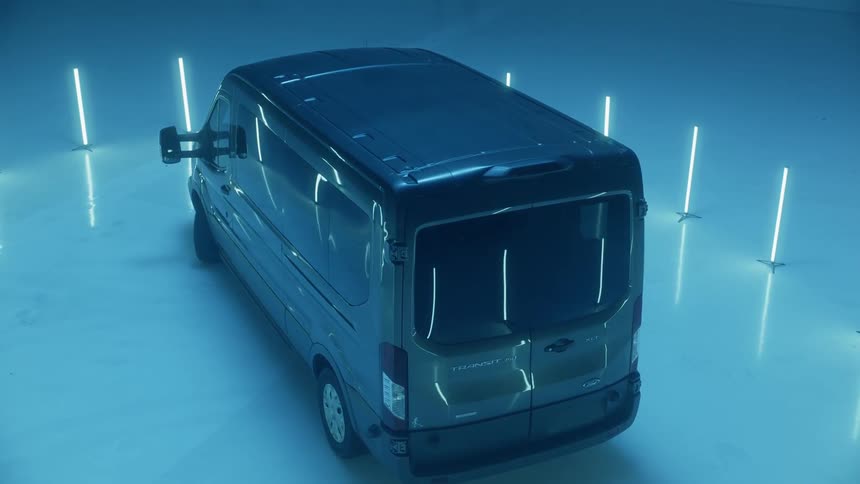 A van is surrounded by glowing lights in a warehouse