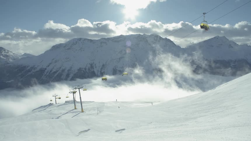 Chair lifts operate at a ski resort