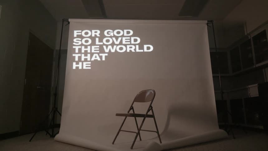 Words are projected onto a screen