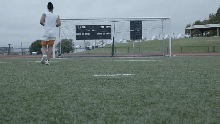 A soccer player practices