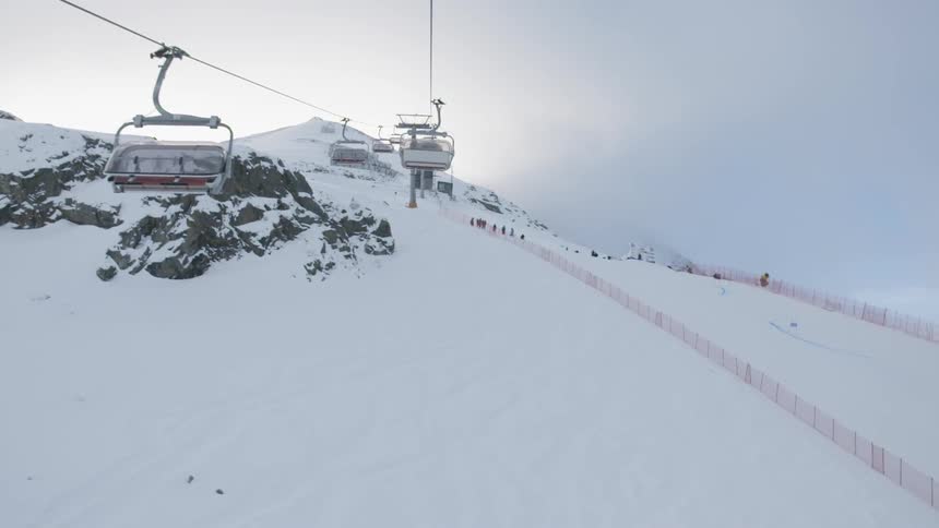 Chair lifts operate at a ski resort