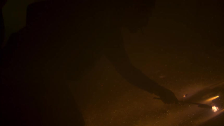 Firework sparks fly around a man
