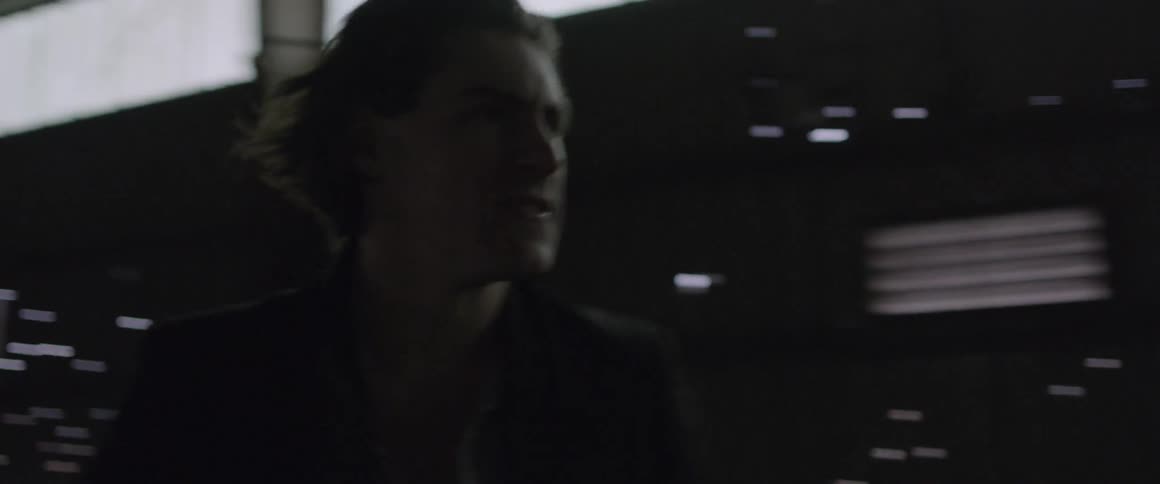 A man walks inside a warehouse building