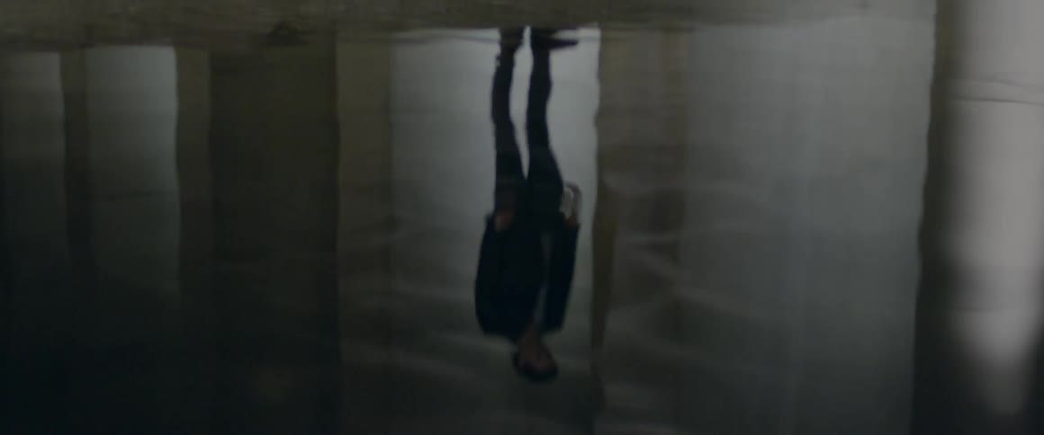 Man's reflection in water