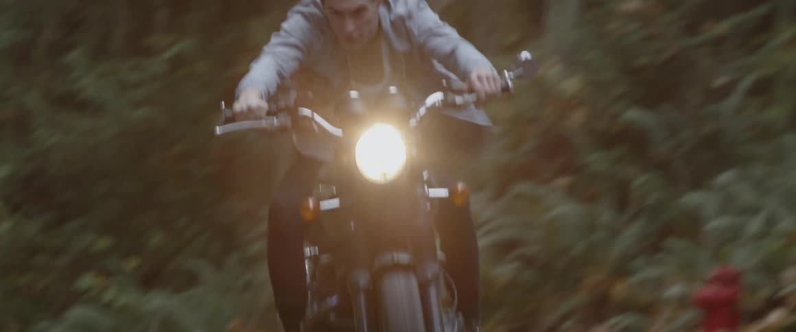 A man rides a motorcycle