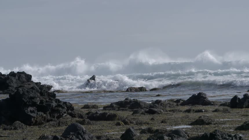 Waves crash onto a rocky beach