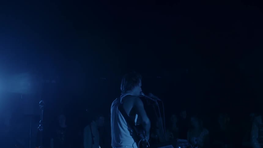 A musical artist performs live