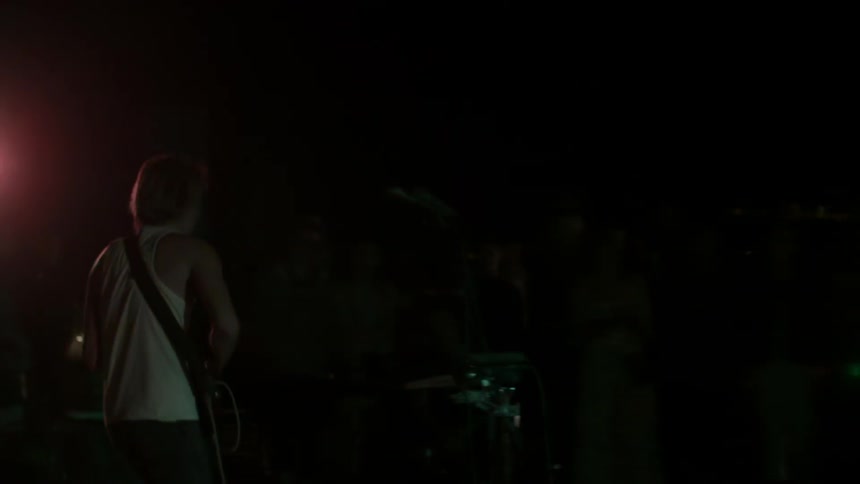 A band performs live onstage