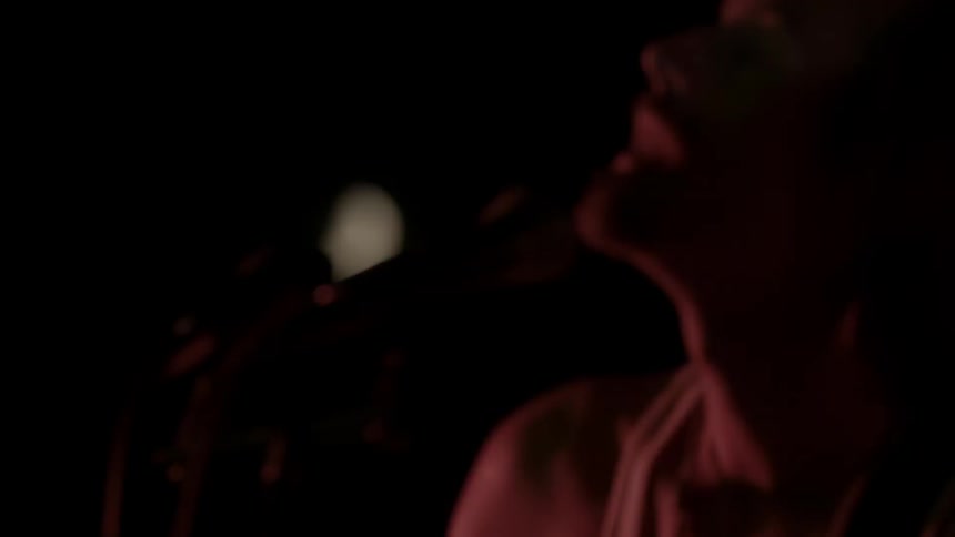 A man singing into a microphone