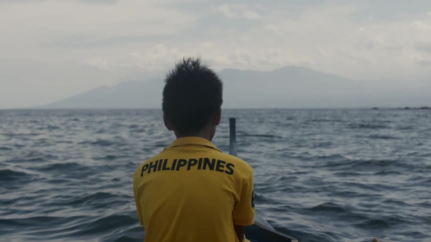 A person is riding in a small boat