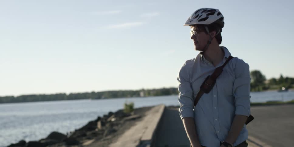 Young Man Commuting On Bike
