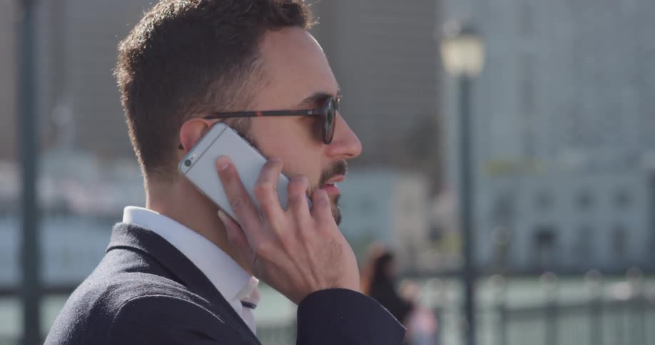 Man talks on a phone in the city