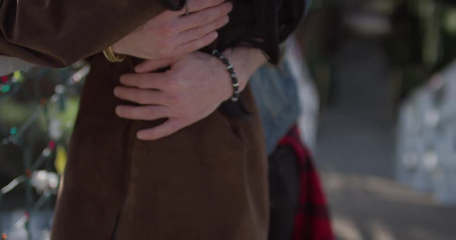 A man and woman hug and embrace