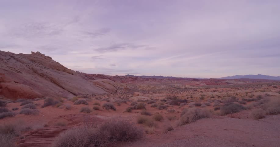 Clouds over bushy hilly desert
