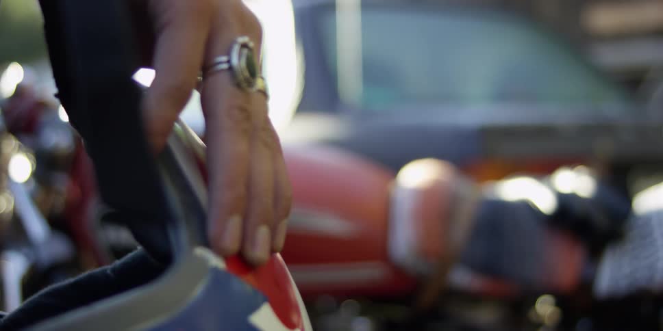 A helmet in someone's hands