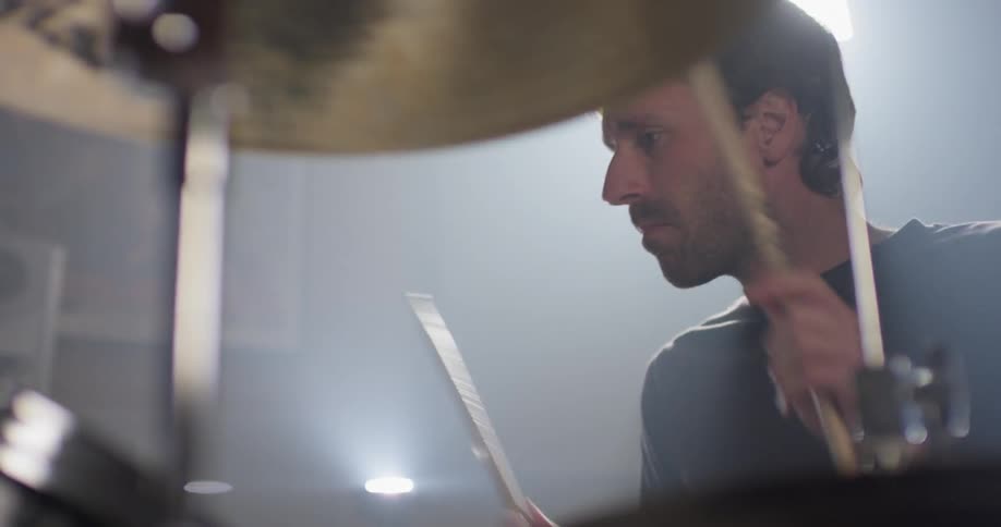 A man plays the drums