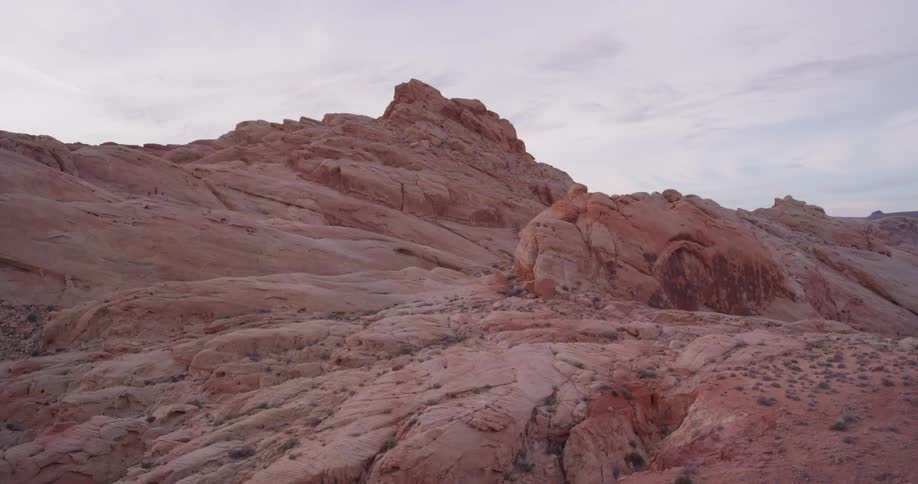 Red colored rock formation in wilderness on cloudy day
