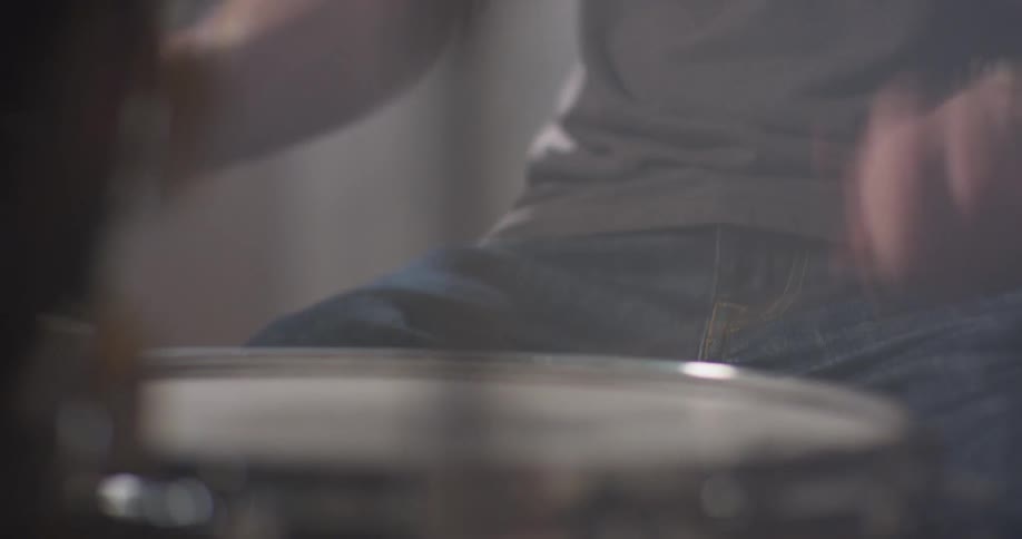 A man plays on the drums
