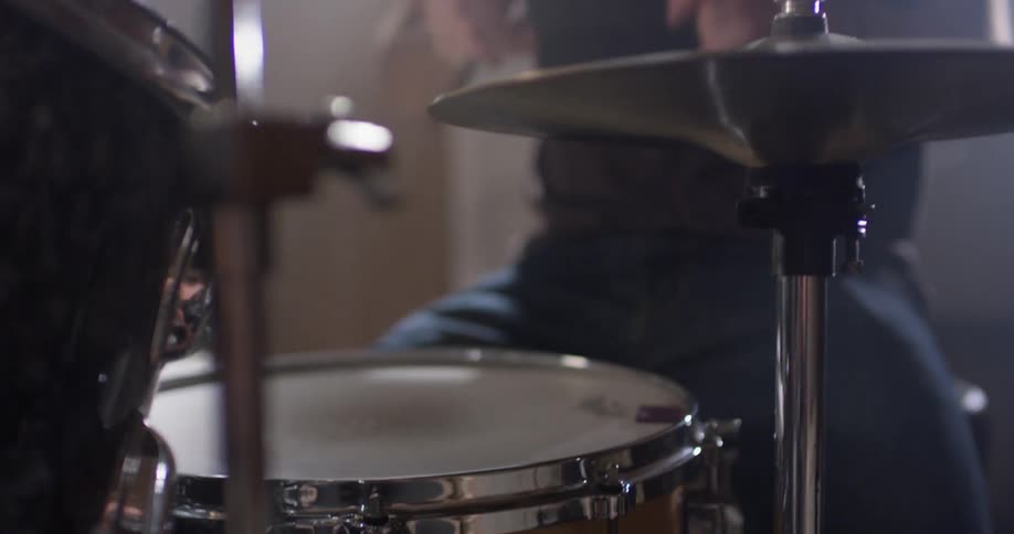 A man plays the drums