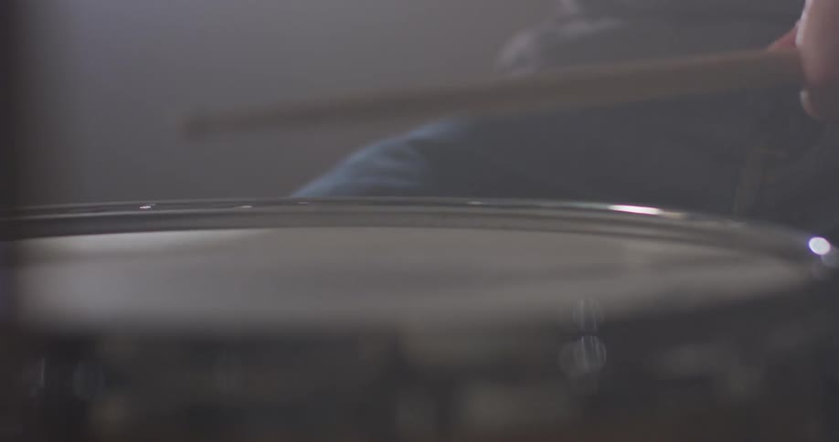 A man plays on the drums