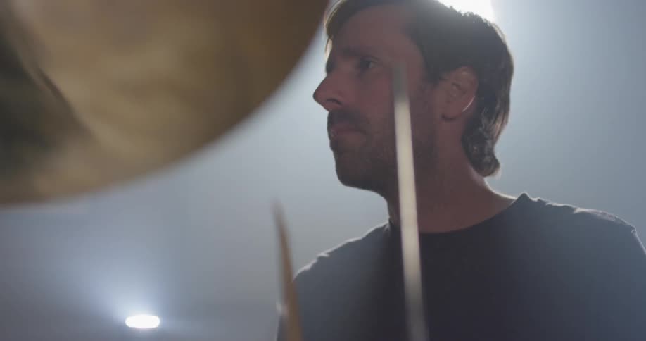 A man plays on the drum set