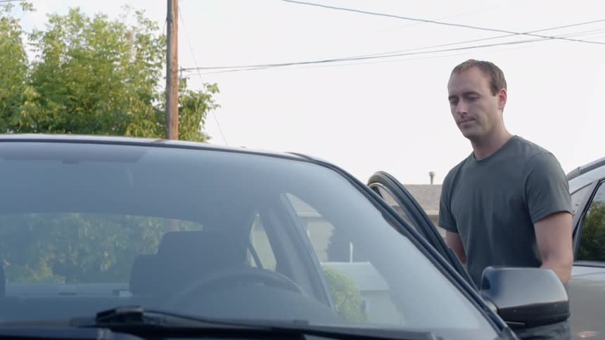 A man opening a car door