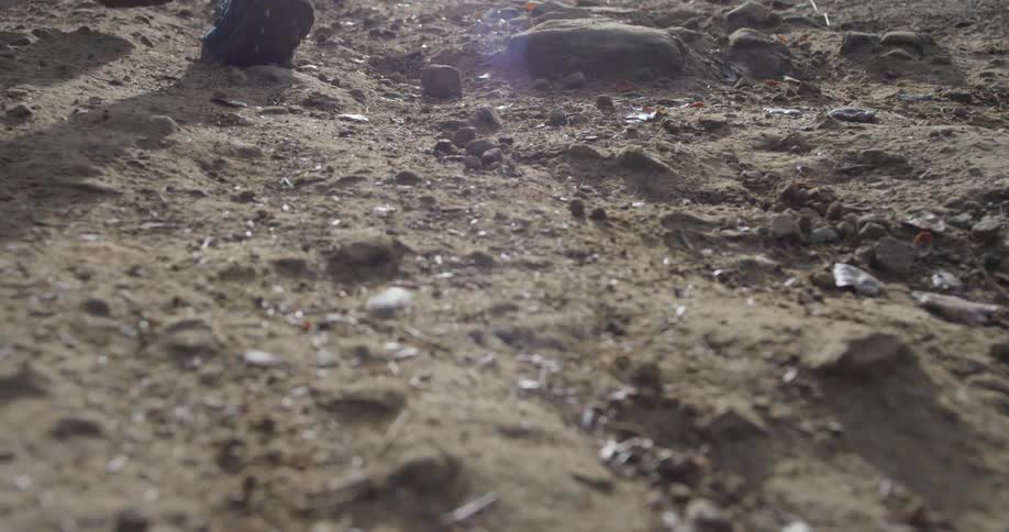 A jogger runs over dirt
