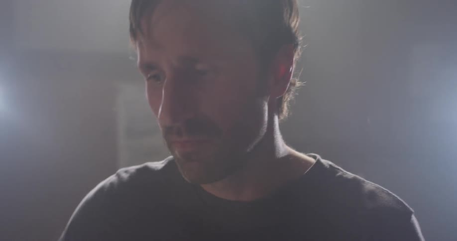 A man plays on the drum kit