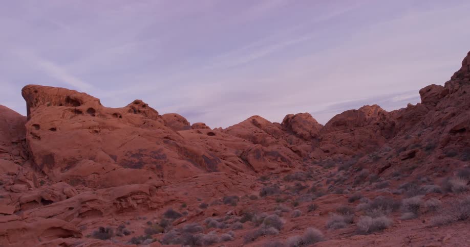 Red rocks cover a desert landscape