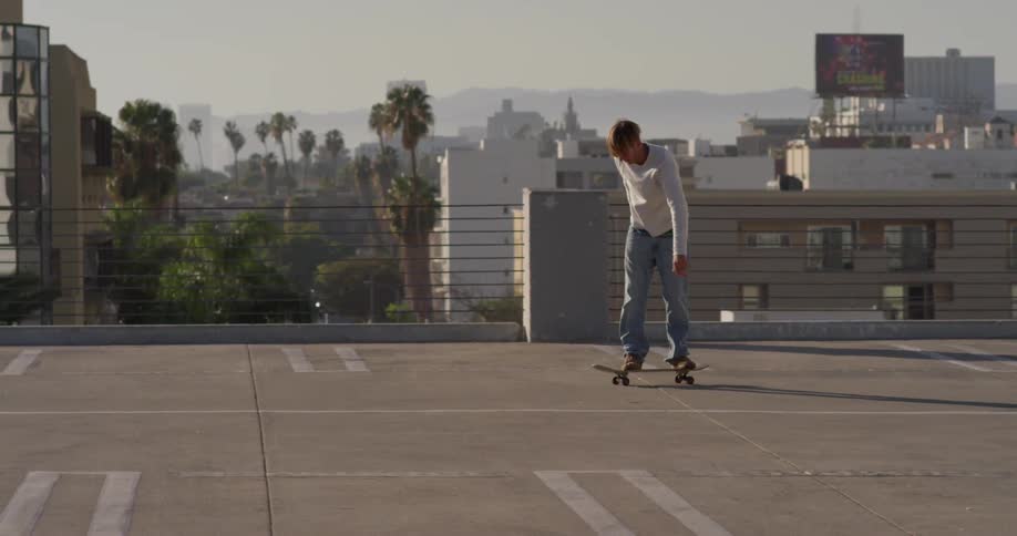 A skateboarder performs a jumping trick