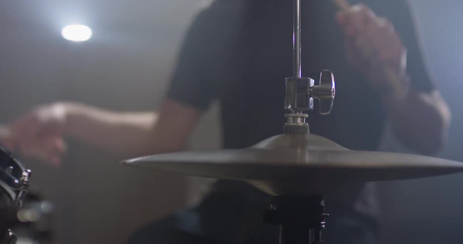 A man plays on the drum set